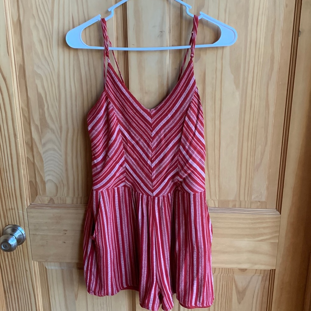 red and white striped romper. adjustable spaghetti straps.